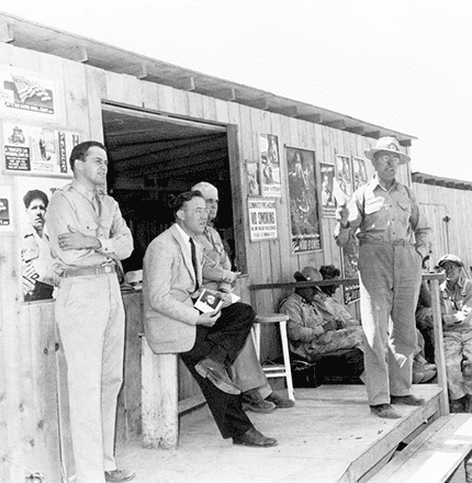 Soren Jacobsen addressing workers outside a job-site office — the first generation of the family's building line