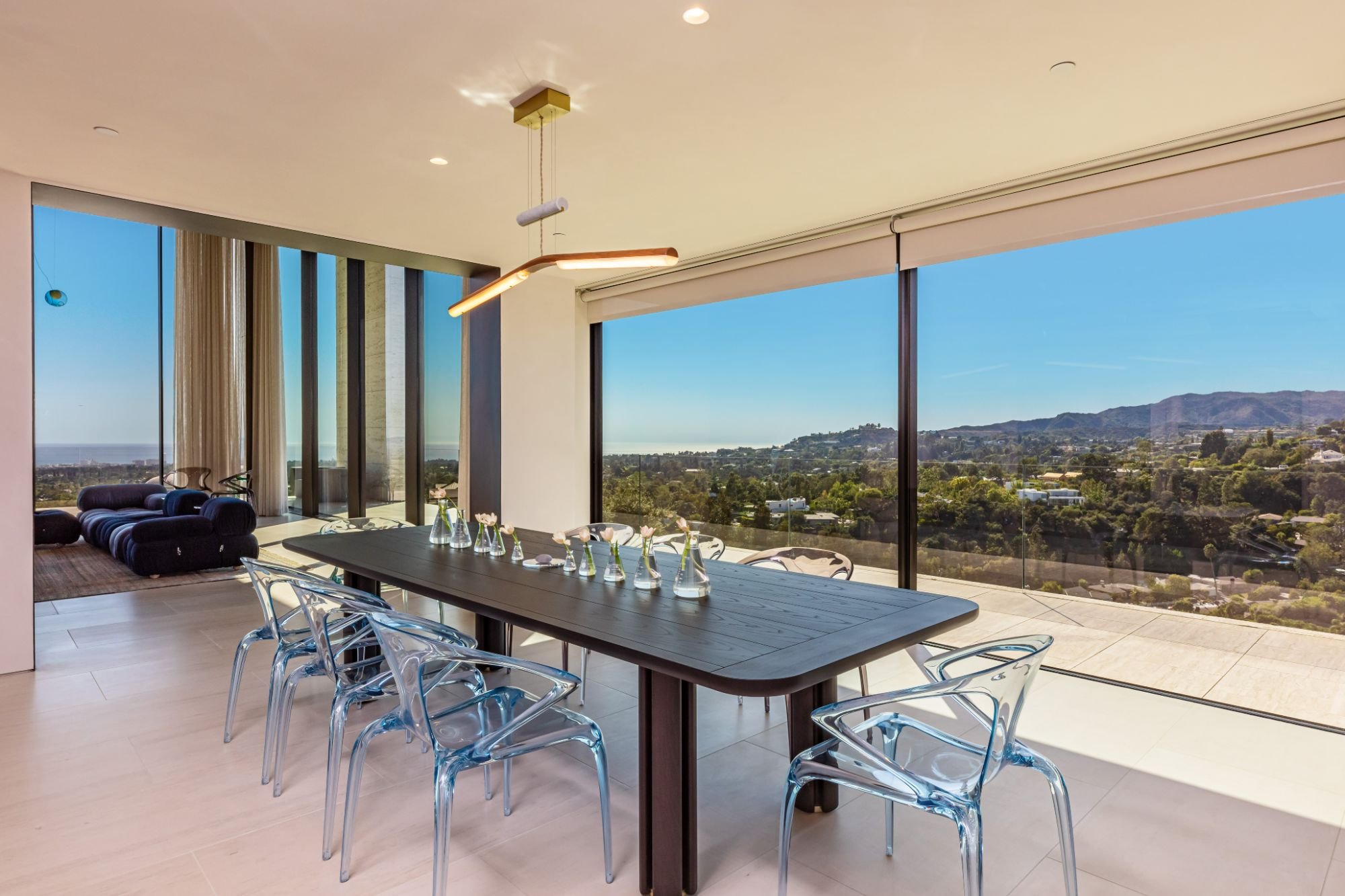The Getty House — 684Firth Brentwood CA LA Dining Room Panoramic City View Floor to Ceiling Glass Ghost Chairs Modern Table  Mod