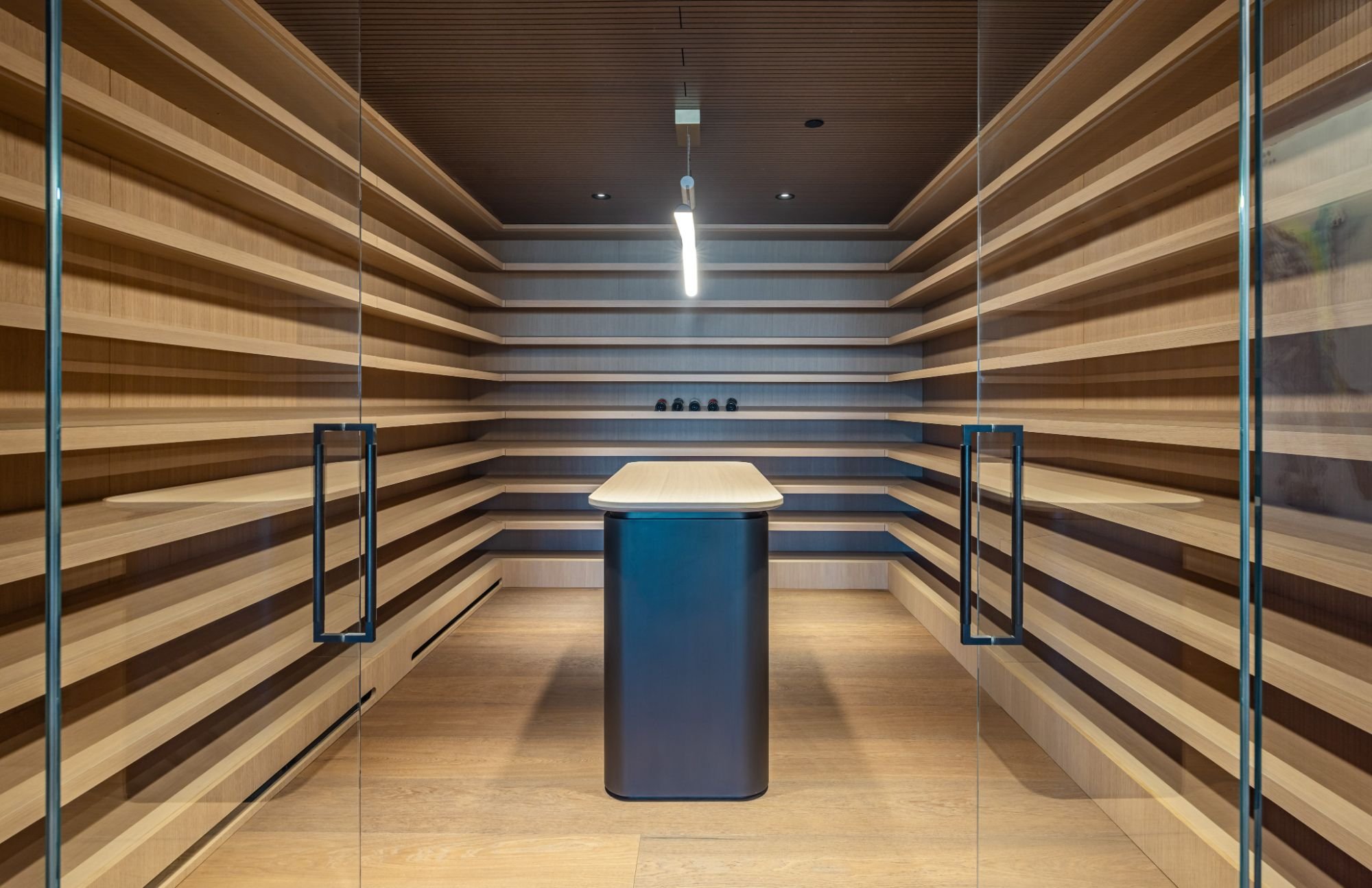 The Getty House — 684Firth Brentwood CA LA Wine Cellar Horizontal Wood Shelving Glass Doors Modern Tasting Table  Modern Home
