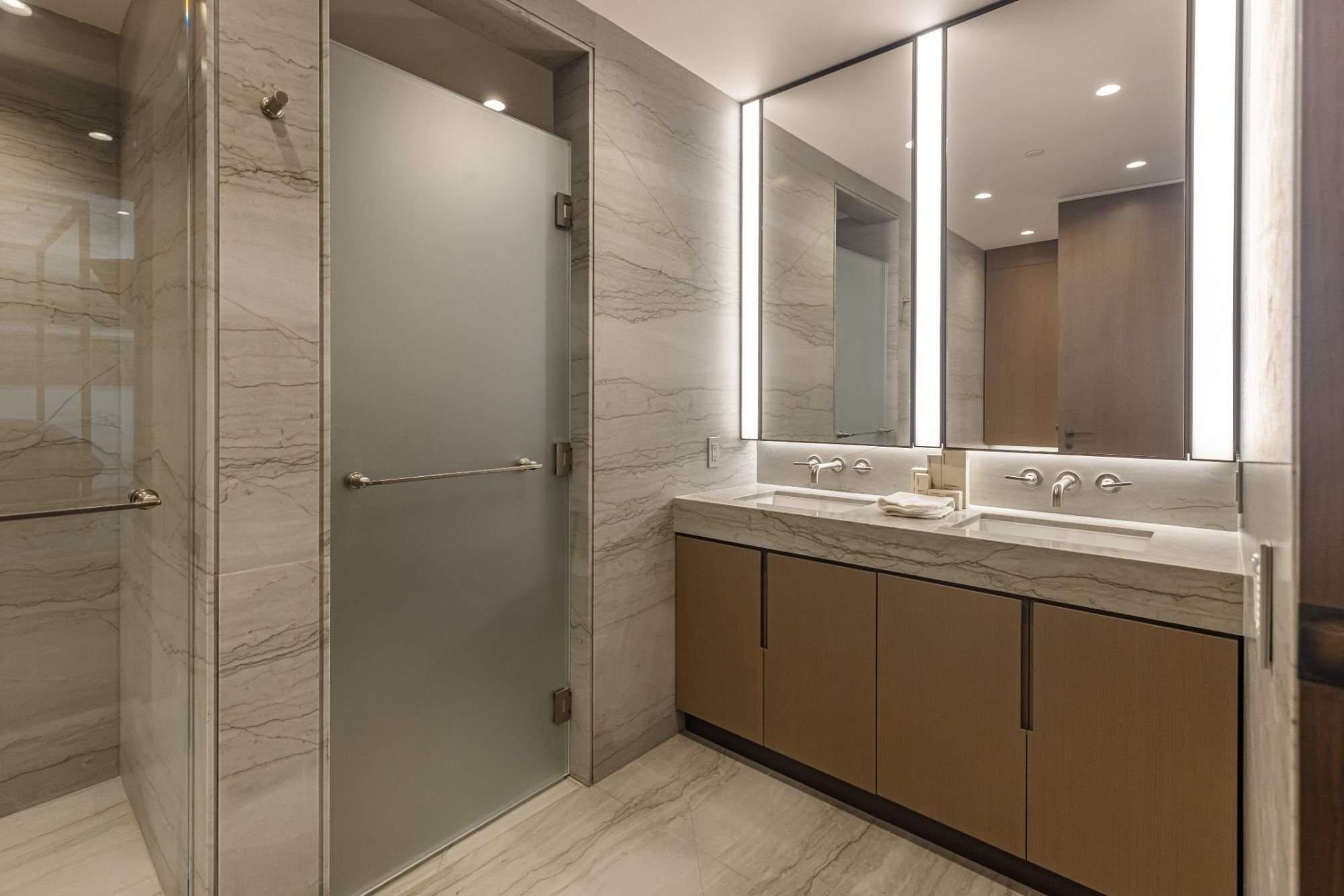Getty House — master bath with marble walls and double vanity