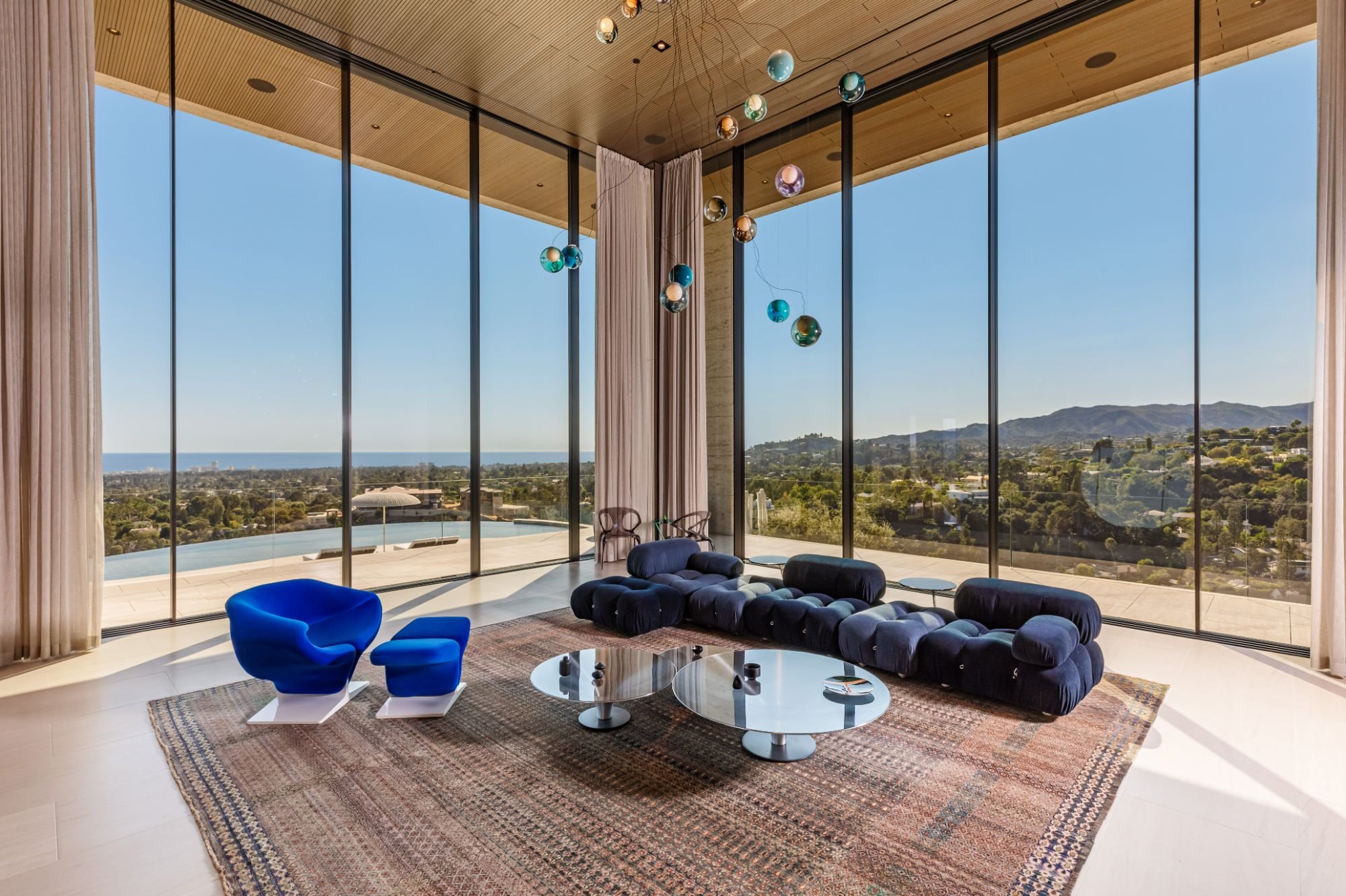 Getty House — living room with ocean view through floor-to-ceiling glass