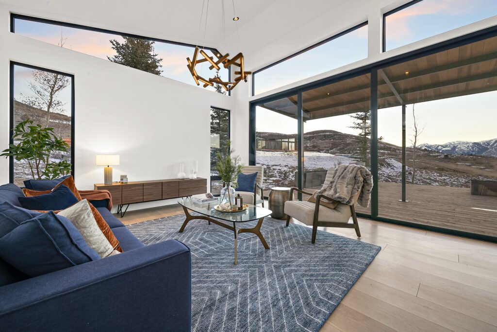 Icon Haus — Icon House Benloch Heber City Living Room Vaulted Ceiling Sliding Doors Geometric Rug Mid Century Credenza  Mo