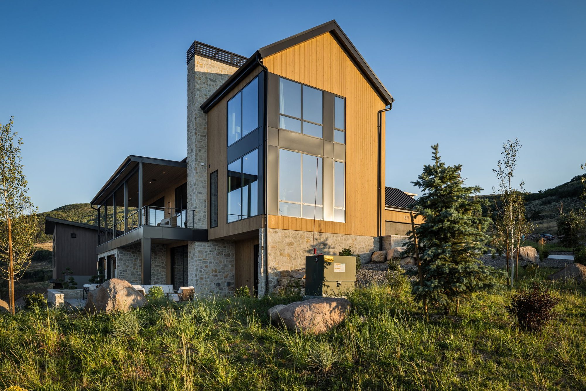 Lumen — double-height glass gable above the covered deck, Benloch Ranch