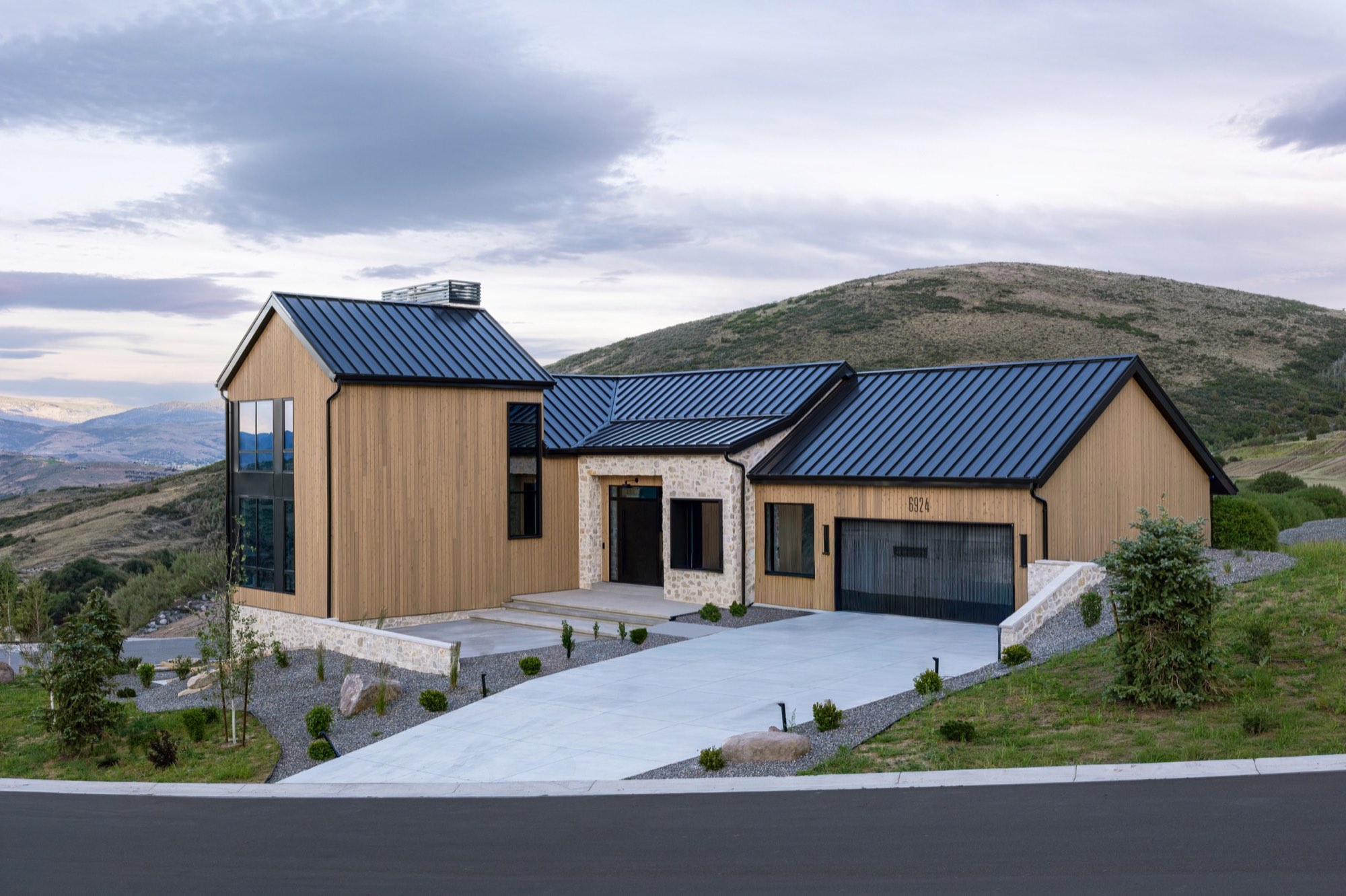 Lumen — front elevation with driveway and hillside behind, Benloch Ranch