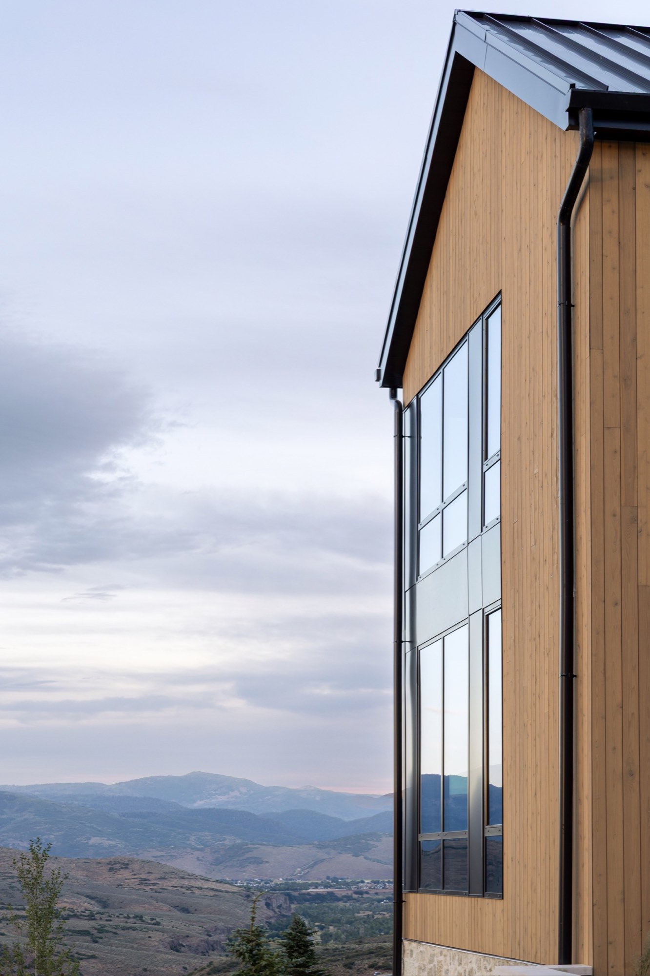 Lumen — gable window with the Jordanelle valley beyond