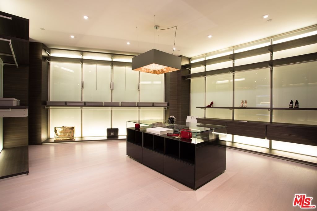 Thrasher Ave — boutique-style dressing room with backlit display cabinetry